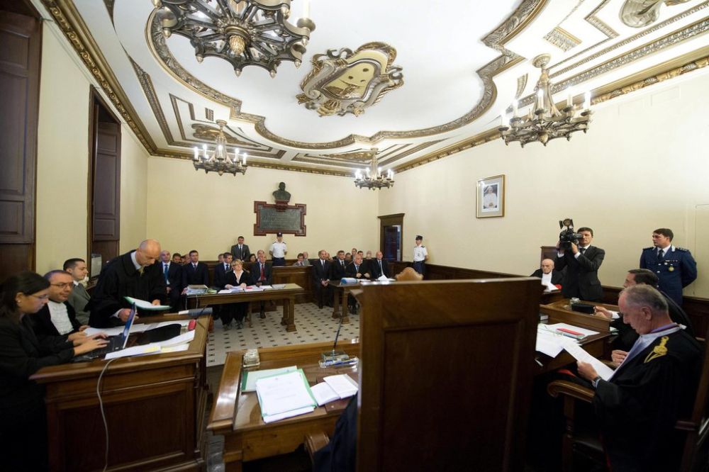 epa03414572 A handout picture provided 29 September 2012  by Osservatore Romano shows a general view during the trial in the Vatican City  against Paolo Gabriele (third from left), Pope Benedict's former butler  accused of  stealing sensitive papal documents and leaking them to the media  . The trial procedures will be based on a 19th century Italian penal code and could result in a prison sentence of up to four years for Gabriele. Also on trial is Claudio Sciarpelletti, a computer expert charged with aiding and abetting.  EPA/OSSERVATORE ROMANO   EDITORIAL USE ONLY/NO SALES