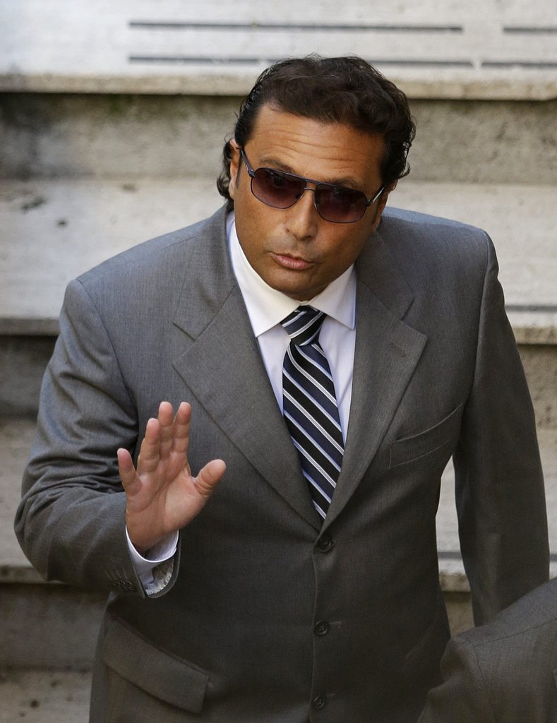 The former captain of the Costa Concordia luxury cruise ship Francesco Schettino arrives at the Teatro Moderno theater for the second hearing of a trial for the Jan. 13, 2012 shipwreck in which 32 people died, in Grosseto, Italy, Tuesday, Oct. 16, 2012. The case of Schettino, 51, is of such interest that a theater had to be turned into a courtroom to accommodate those who had a legitimate claim to be at the closed-door hearing. (AP Photo/Gregorio Borgia)
