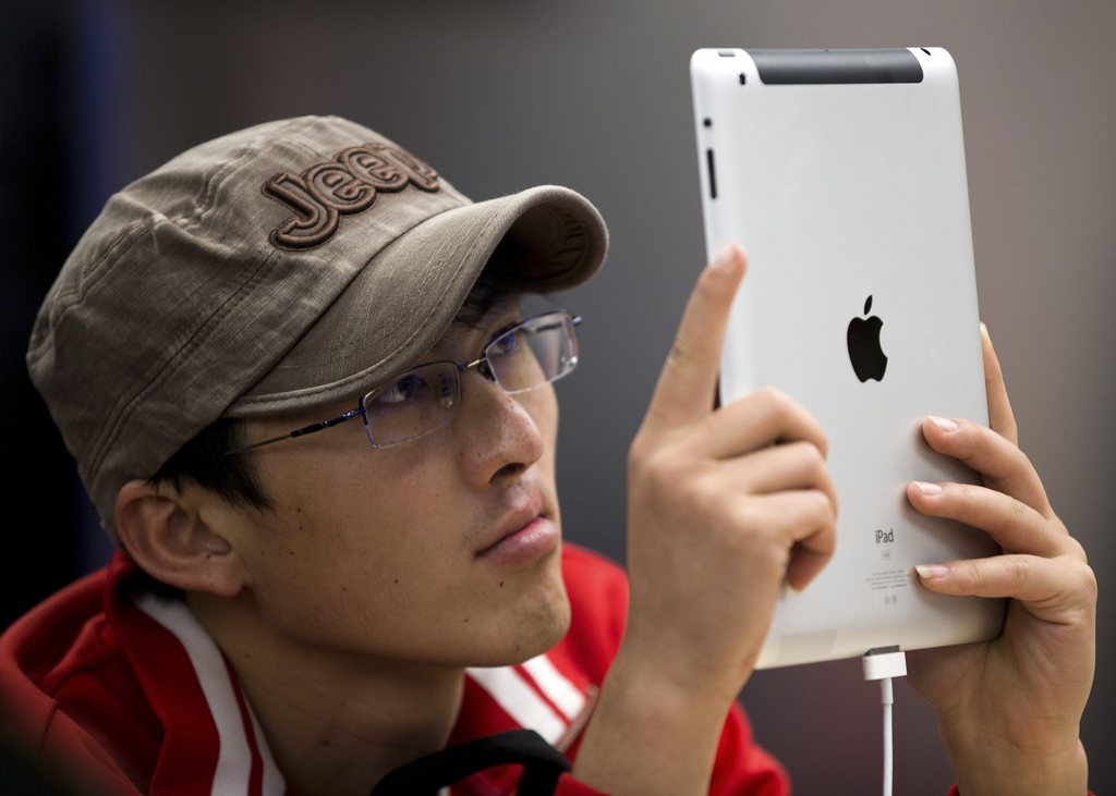 Un nouvel Apple Store a ouvert ses portes dans le quartier de Wangfujing de Pékin, samedi 20 octobre. C'est le plus grand magasin Apple d'Asie.