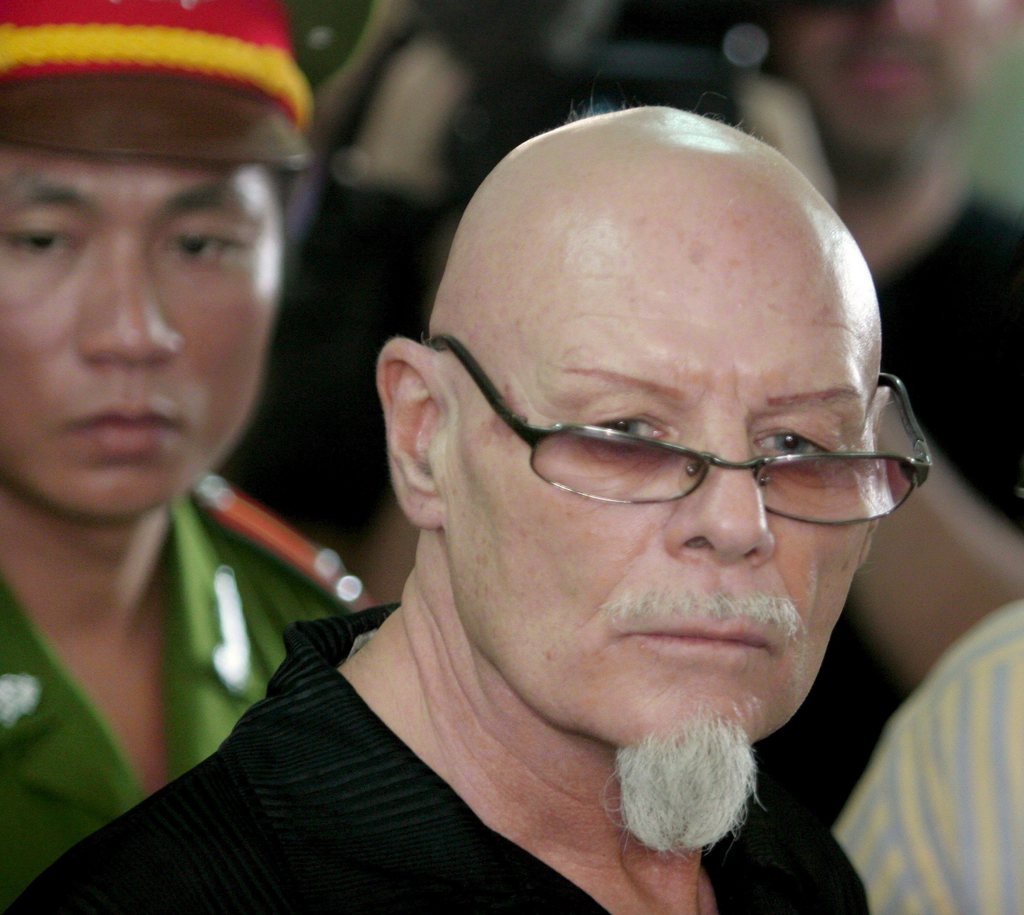 epa01446269 (FILES) A file photograph dated 03 March 2006 showing British glam rock star Gary Glitter listening to the verdict as he is convicted in his child molestation case in the provincial courtroom of Ba Ria, 80 kilometers northeast of Ho Chi Minh City, Vietnam.  British rock star Glitter will be deported to Britain on 19 August 2008, after completing a 27-month sentence for molesting two young girls, his lawyer said 14 August 2008.  EPA/JULIAN ABRAM WAINWRIGHT