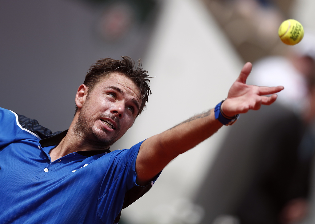 epa06768504 Stan Wawrinka of Switzerland in action against Guillermo Garcia-Lopez of Spain during their menís first round match during the French Open tennis tournament at Roland Garros in Paris, France, 28 May 2018.  EPA/IAN LANGSDON