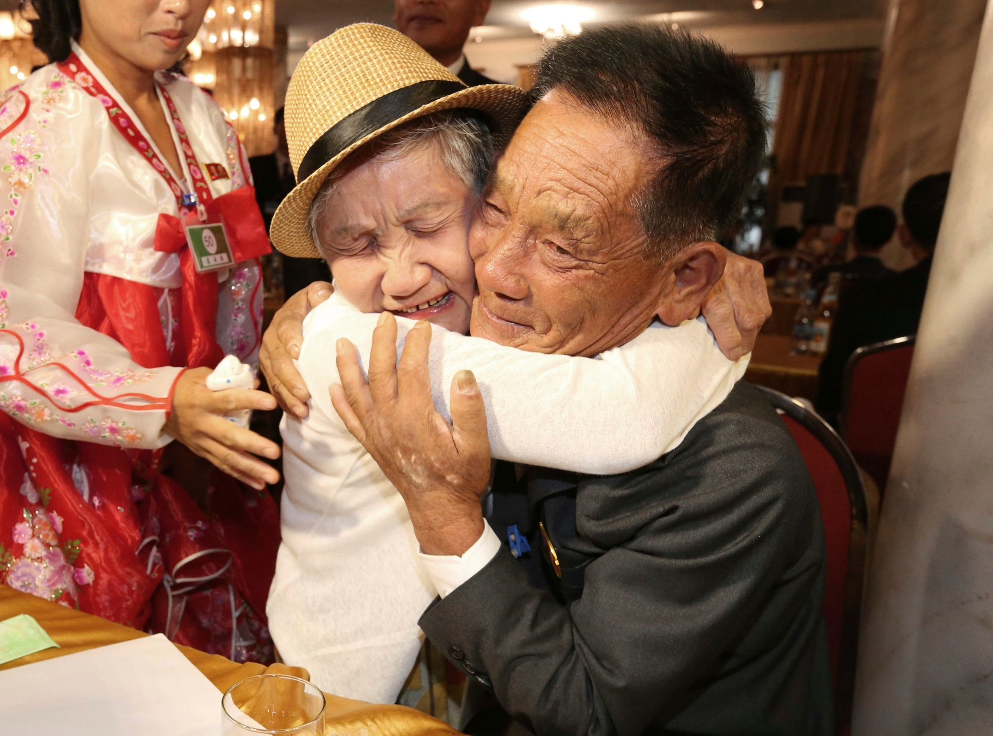 South Korean Lee Keum-seom, 92, left, weeps as she meets with her North Korean son Ri Sang Chol, 71, during the Separated Family Reunion Meeting at the Diamond Mountain resort in North Korea, Monday, Aug. 20, 2018. Dozens of elderly South Koreans crossed the heavily fortified border into North Korea on Monday for heart-wrenching meetings with relatives most haven't seen since they were separated by the turmoil of the Korean War. (Korea Pool Photo via AP) South Korea Koreas Family Reunions