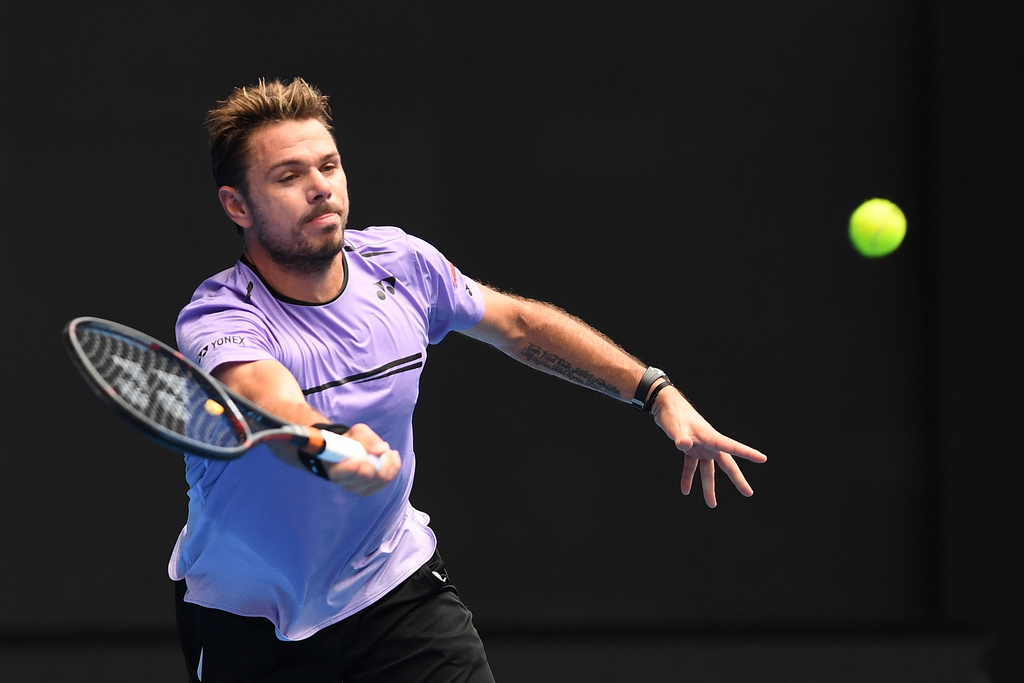 epa07291338 Stan Wawrinka of Switzerland in action against Milos Raonic of Canada during their second round match on day four of the Australian Open tennis tournament in Melbourne, Australia, 17 January 2019.  EPA/JULIAN SMITH  AUSTRALIA AND NEW ZEALAND OUT