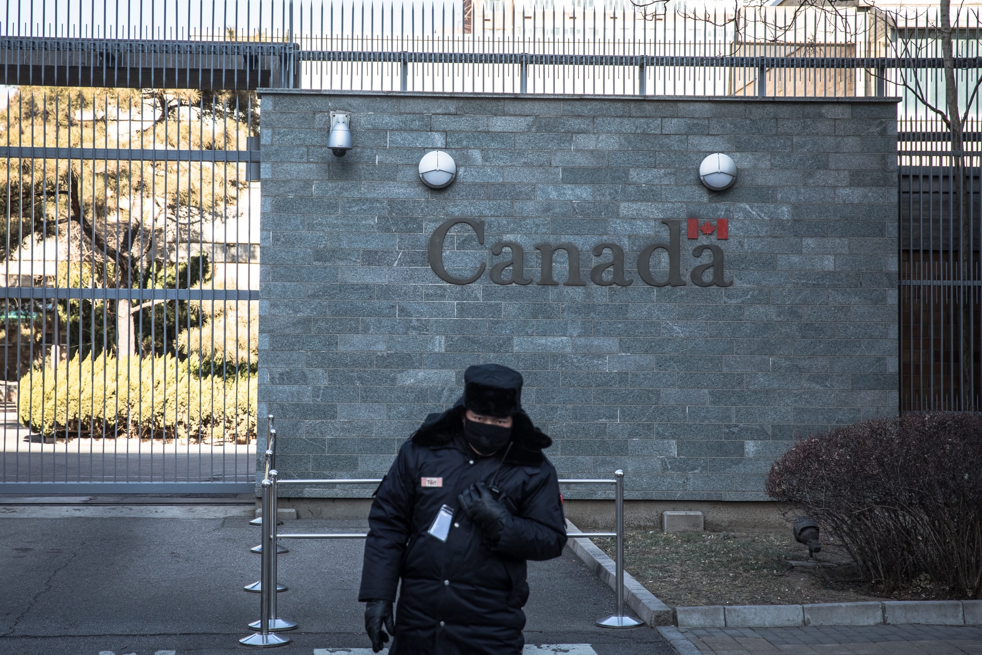 epa07285154 A Chinese security official stands guard in front of the Canadian embassy in Beijing, China, 15 January 2019. A Chinese court issued a death sentence to Robert Lloyd Schellenberg of Canada for drug smuggling. On 14 January 2019, following an appeal, a high court in Dalian city changed the man's previous 15 years in prison sentence for drug smuggling and sentenced him to death, saying his previous sentence was too lenient, according to media reports. The ruling comes during a diplomatic row between Canada and China after Canadian authorities arrested Meng Wanzhou, an executive for Chinese telecommunications firm Huawei, at the request of the USA.  EPA/ROMAN PILIPEY CHINA CANADA COURT