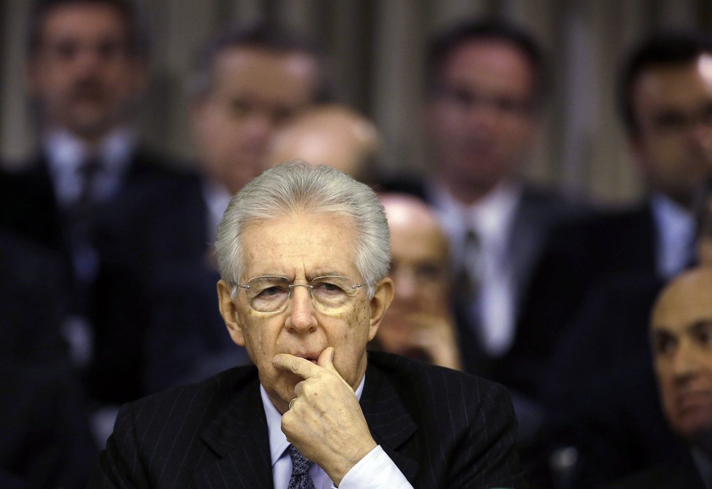 Italian Premier Mario Monti delivers his speech at the Foreign Ministry for the Italian Ambassadors conference in Rome, Friday, Dec. 21, 2012. Monti pledged to resign as soon as the budget law is passed after Silvio Berlusconi yanked support for his government, accelerating national elections now expected in February. The budget law was approved Friday afternoon. (AP Photo/Gregorio Borgia)