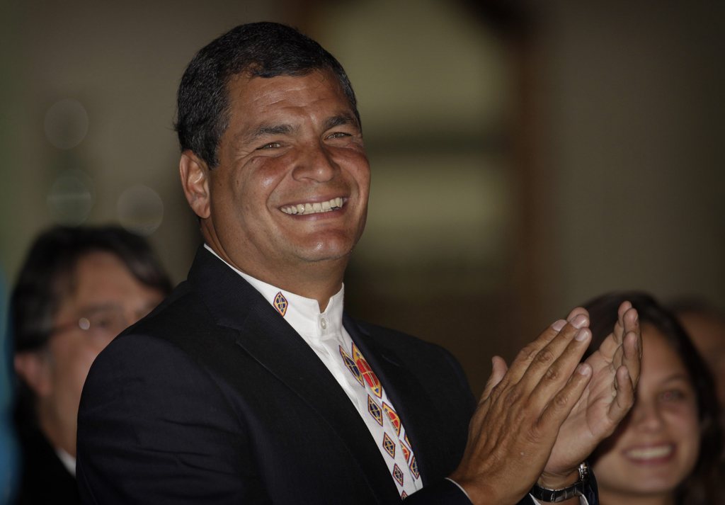 Ecuador's President Rafael Correa celebrates his election victory in Quito, Ecuador, Sunday, Feb.17, 2013. Correa coasted to a second re-election on Sunday winning 56.7 percent of the vote against 24 percent for his closest challenger, former Banco de Guayaquil chief Guillermo Lasso, with 36 percent of the vote counted.(AP Photo/Dolores Ochoa)