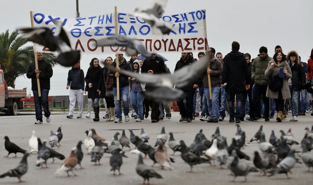Hundreds of University students protest against austerity measures affecting the education budget in the northern port city of Thessaloniki, Greece. Greek conservative-led government plans to reduce the number of higher education departments in the new academic year.  The banner reads in Greek "No to the termination of Thessaloniki's technical college " (AP Photo/Nikolas Giakoumidis)