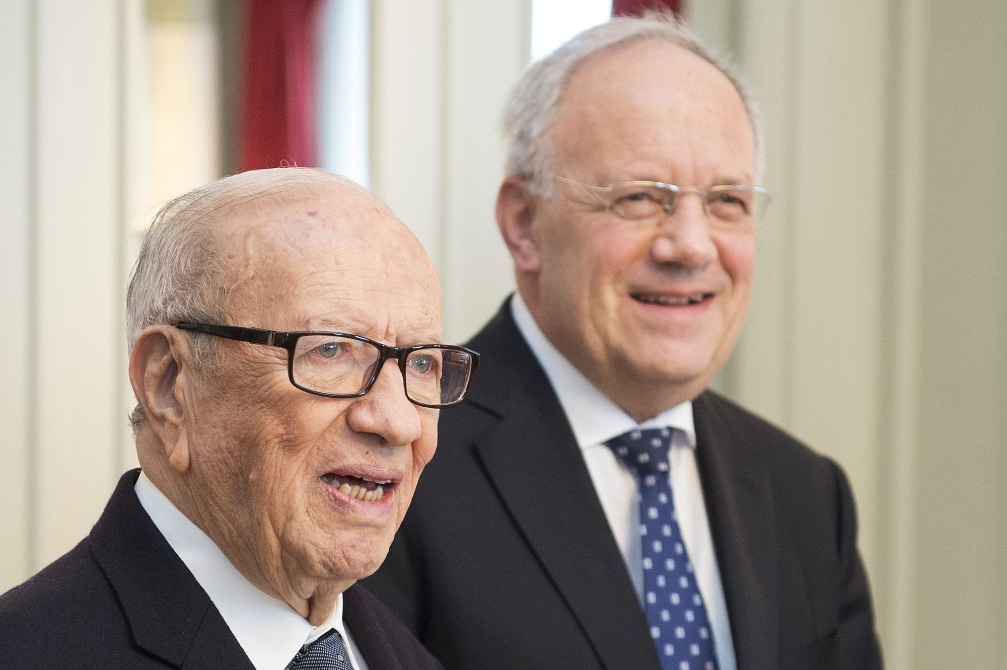 Tunisiaís President Beji Caid Essebsi, left, and Federal President of Switzerland, Johann Schneider-Ammann, right, are smiling during a signing ceremony in Bern, Switzerland, Friday, February 19, 2016. Essebsi is on a two day state visit to Switzerland. (KEYSTONE/Peter Schneider) SWITZERLAND TUNISIA STATE VISIT