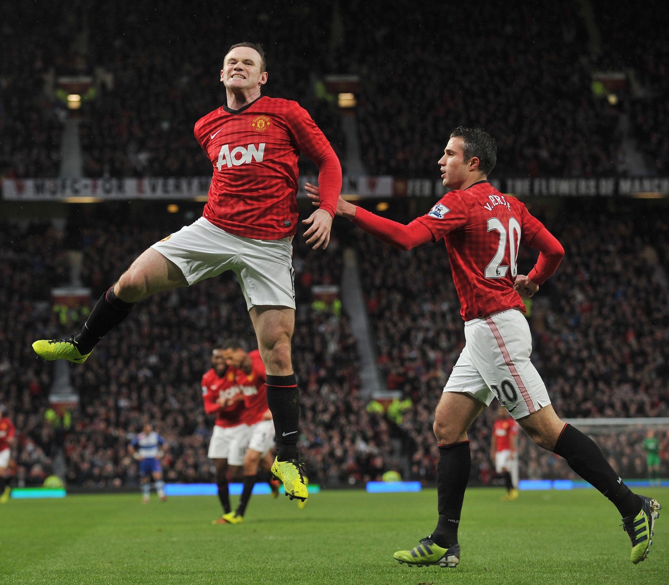 Wayne Rooney (L) of Manchester United celebrates his goal which makes the game 1-0 to Man Utd during the English Premier League soccer match between Manchester United and Reading at Old Trafford, Britain, 16 March 2013.  EPA/DAVID RICHARDS DataCo terms and conditions apply. https://www.epa.eu/downloads/DataCo-TCs.pdf