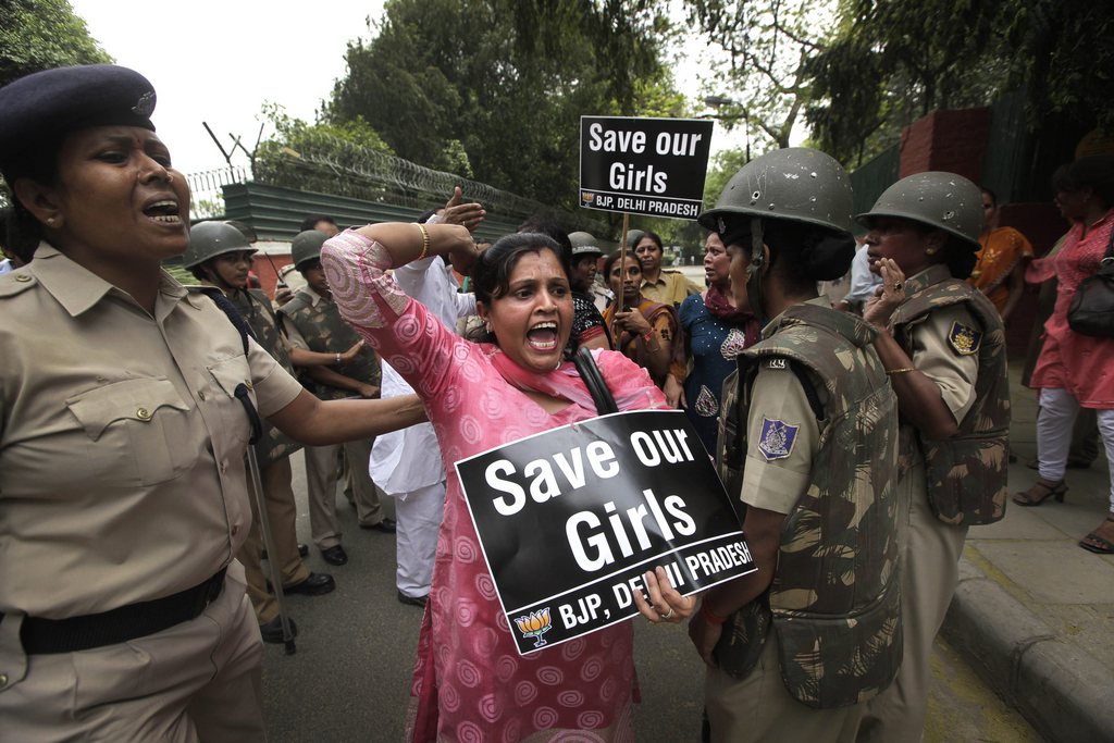 An Indian women activist of India main opposition Bharatiya Janata Party shouts slogans outside ruling United Progressive Alliance chairperson Sonia Gandhi?s residence during a protest against the rape of a 5-year-old girl in New Delhi, India, Sunday, April 21, 2013. The girl was raped and tortured by a man who held her in a locked room in India's capital for two days. (AP Photo/Manish Swarup)