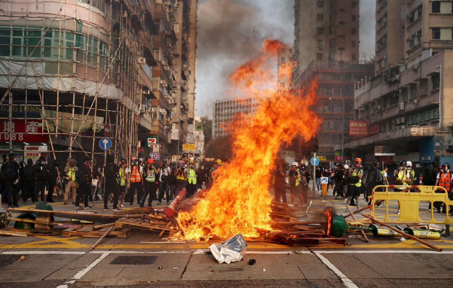 epa07935925 Flames rise from barricades that were set on fire during a rally to abolish the anti-mask law in Hong Kong, China, 20 October 2019. Hong Kong has witnessed several months of ongoing mass protests, originally triggered by a now withdrawn extradition that have turned into a wider pro-democracy movement.  EPA/JEROME FAVRE CHINA HONG KONG PROTESTS