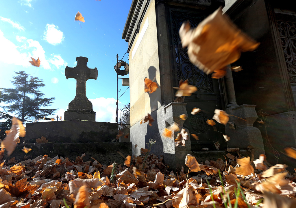 A tomb is seen in "Pere Lachaise" cemetery during All Saints Day, a Catholic holiday in honour of all the saints and deceased relatives, in Paris, France, Thursday, Nov. 1, 2012. (AP Photo/Jacques Brinon)