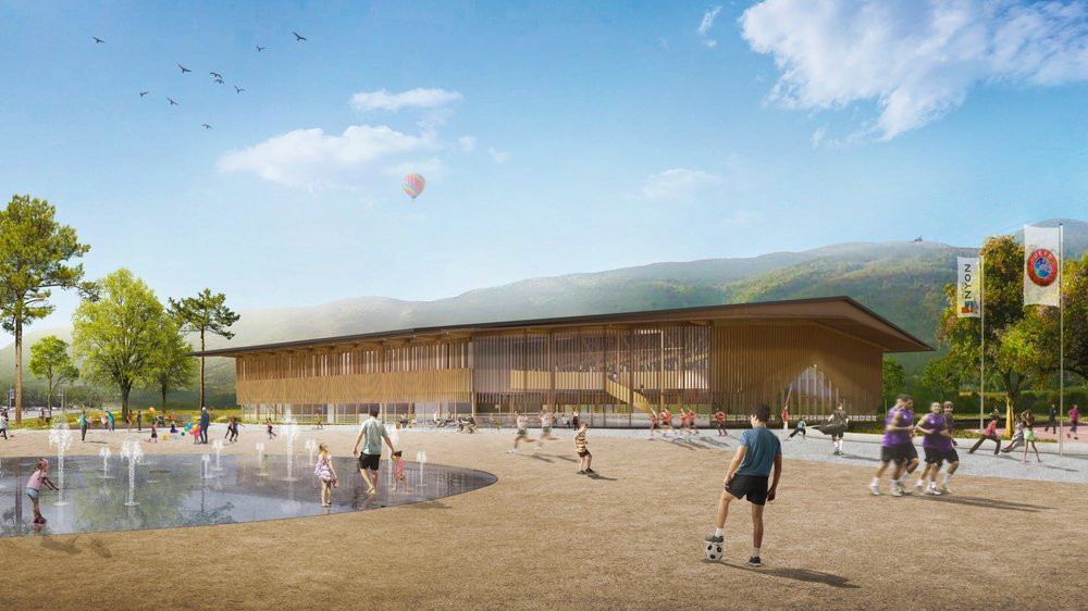 Le nouveau complexe prévoit une Maison du Sport comprenant une salle triple, deux nouveaux terrains extérieurs, un skatepark et une grande esplanade des deux côtés de la route cantonale.