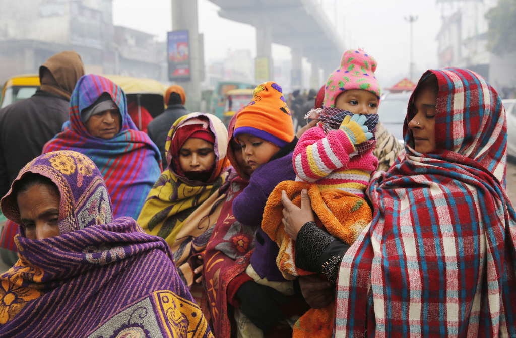 Des enfants devant se protéger contre la pollution de l'air en Inde (illustration).