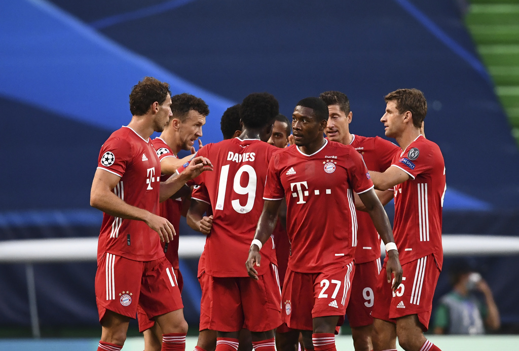 Bayern's Serge Gnabry celebrates with teammates after scoring his side's opening goal during the Champions League semifinal soccer match between Lyon and Bayern at the Jose Alvalade stadium in Lisbon, Portugal, Wednesday, Aug. 19, 2020. (Franck Fife/Pool via AP)